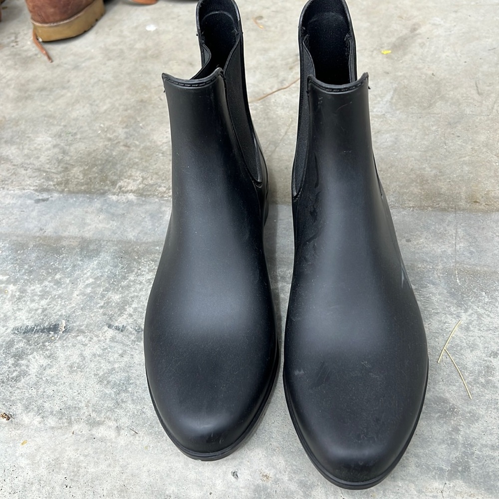 Brand new black rain boots.  Narrow toe.  Itsy tiny heel.